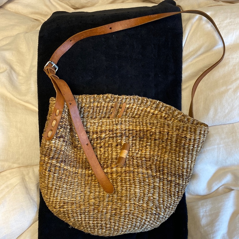 Handcrafted woven straw crossbody bag with leather straps